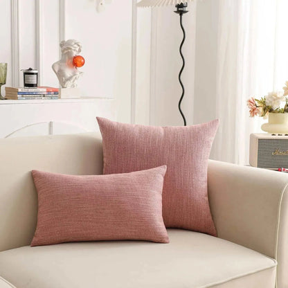 Natural linen throw pillow covers on a sofa in a cozy living room setting.