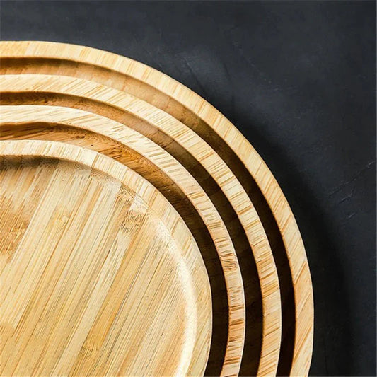 Round wooden serving trays, stackable design, natural grain.