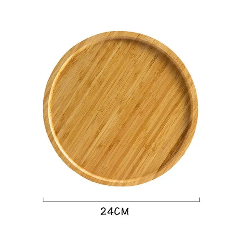 Round wooden serving tray with a smooth surface, featuring a natural grain and slightly raised edge, measuring 24cm.