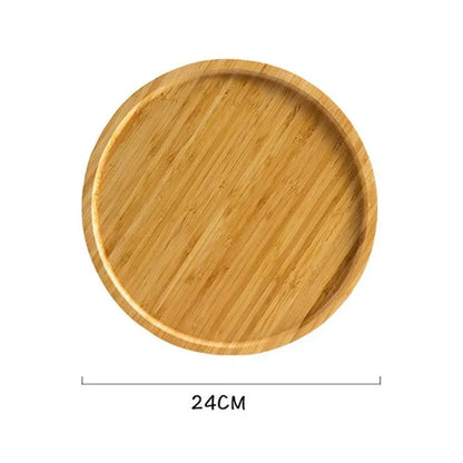 Round wooden serving tray with a smooth surface, featuring a natural grain and slightly raised edge, measuring 24cm.