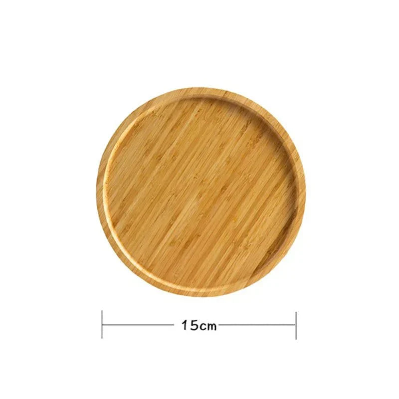 Round wooden serving tray with a smooth surface, measuring 15cm, ideal for serving snacks or decor.