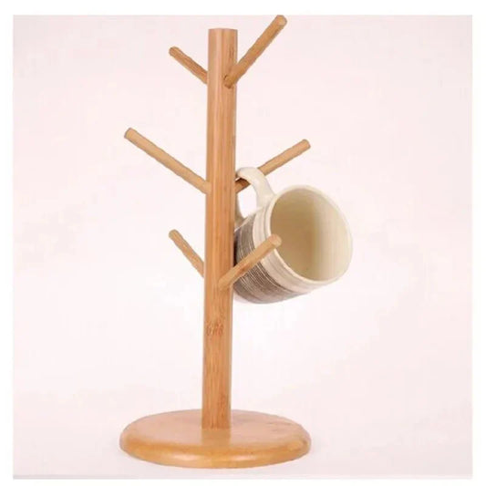 Rotating wooden cup stand with mug on branch-shaped arms.