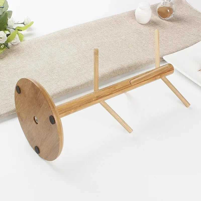 Rotating wooden cup stand in tree shape with six hooks for kitchen counter.
