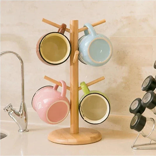 Rotating wooden cup stand with mugs, kitchen counter display.