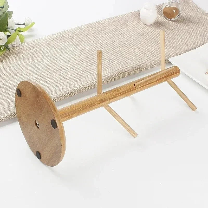 Rotating bamboo mug tree cup stand featuring a minimalist design for kitchen countertops.