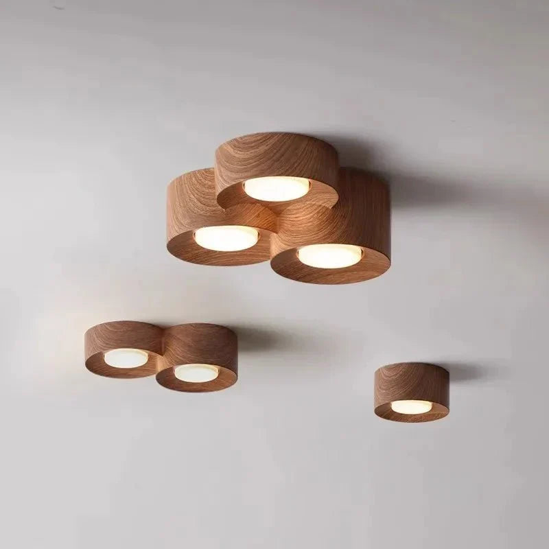 Surface mounted walnut LED ceiling spotlights in a modern design.