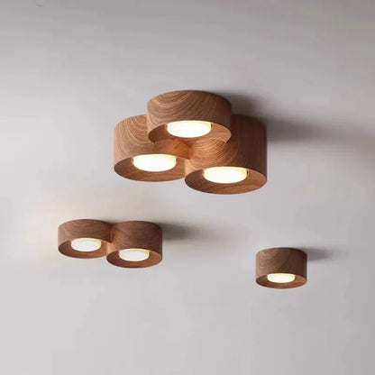 Surface mounted walnut LED ceiling spotlights in a modern design.